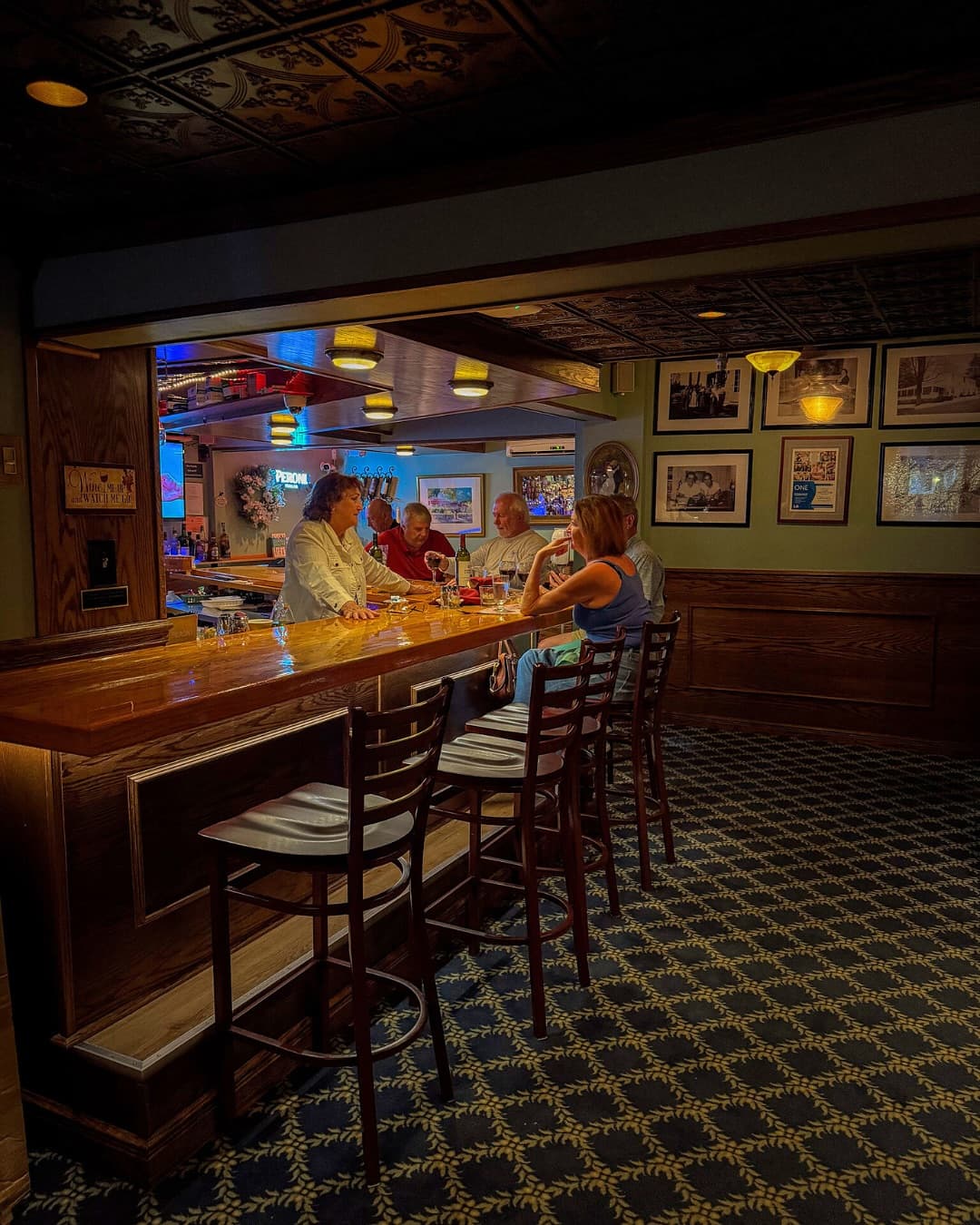 Guests gathered at Mario's full-service wooden bar