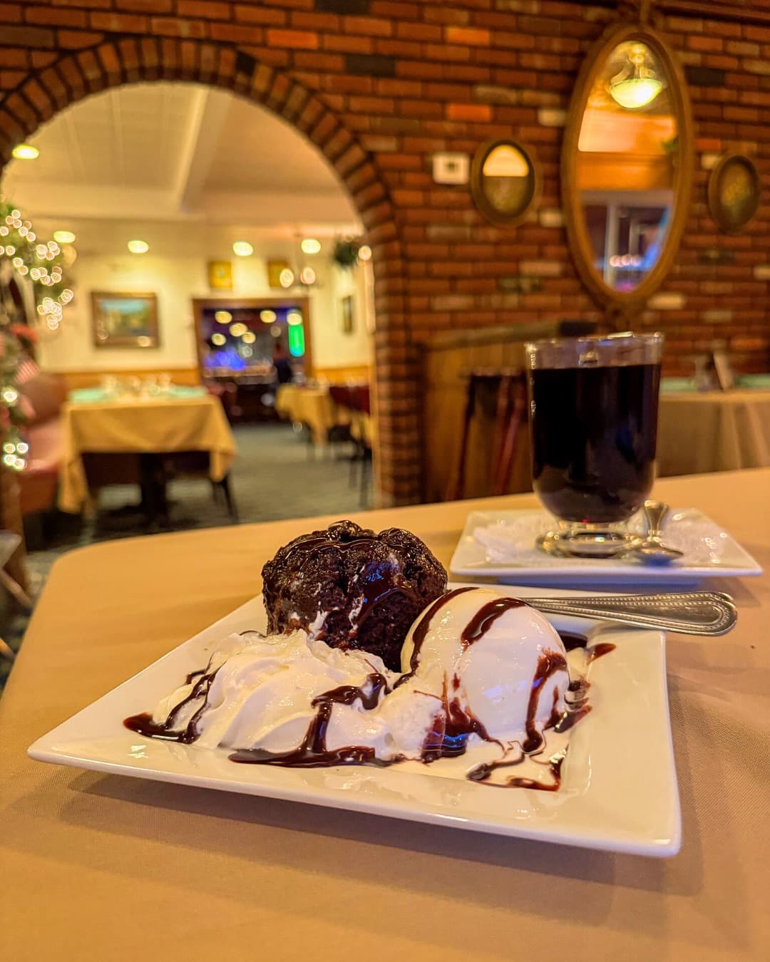 Warm chocolate lava cake with vanilla ice cream and chocolate sauce