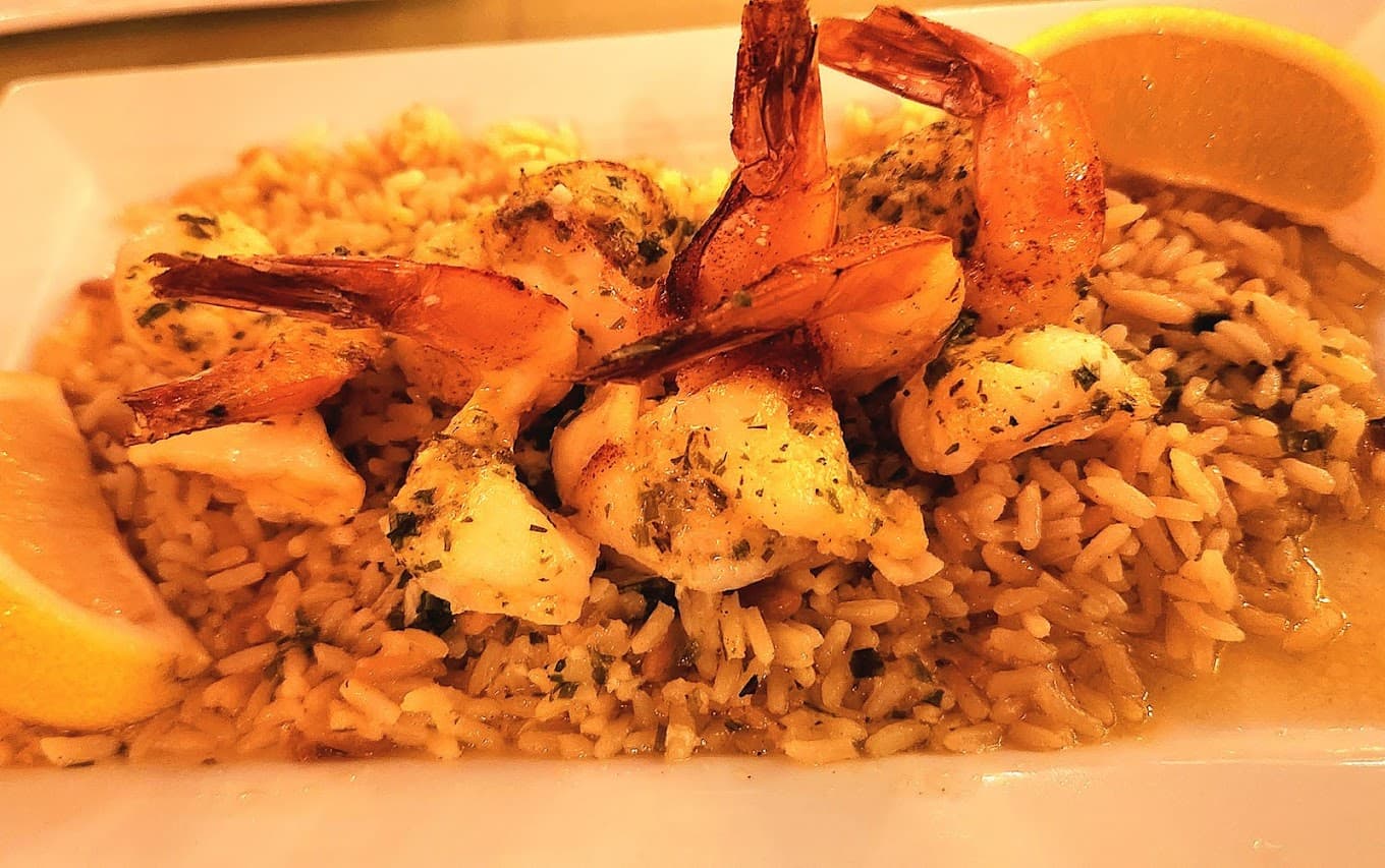 Shrimp Scampi ala Mario — jumbo shrimp in garlic herb butter over rice pilaf